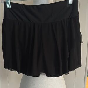 Black bathing suit, bottoms skirt style with shorts underneath